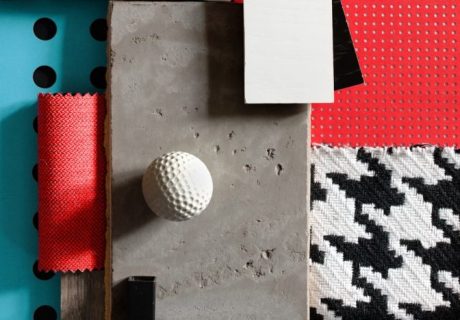 a table topped with lots of different types of fabric