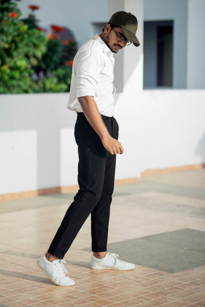 Why it’s Essential: Lightweight and breathable fabrics are perfect for all-day comfort in Bangladesh’s tropical weather. Works well with both formal shirts and casual tees., man in white t-shirt and black pants standing on white floor